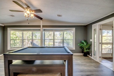 This unique two-bedroom, two-bath home in the gated, golf-course on Lake Fairways Country Club in Florida - for sale on GolfHomes.com, golf home, golf lot