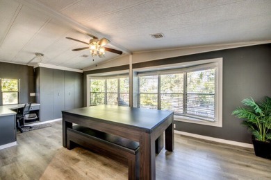 This unique two-bedroom, two-bath home in the gated, golf-course on Lake Fairways Country Club in Florida - for sale on GolfHomes.com, golf home, golf lot