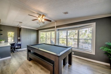 This unique two-bedroom, two-bath home in the gated, golf-course on Lake Fairways Country Club in Florida - for sale on GolfHomes.com, golf home, golf lot