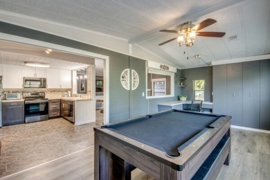 This unique two-bedroom, two-bath home in the gated, golf-course on Lake Fairways Country Club in Florida - for sale on GolfHomes.com, golf home, golf lot