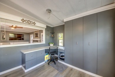 This unique two-bedroom, two-bath home in the gated, golf-course on Lake Fairways Country Club in Florida - for sale on GolfHomes.com, golf home, golf lot