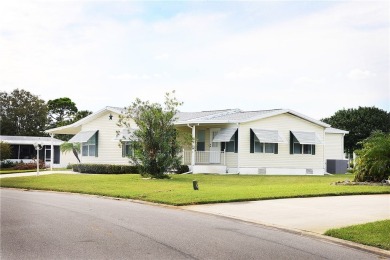 Inviting Triple Wide home on roomy corner double lot. Spacious on Barefoot Bay Golf Course in Florida - for sale on GolfHomes.com, golf home, golf lot