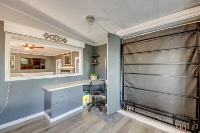 This unique two-bedroom, two-bath home in the gated, golf-course on Lake Fairways Country Club in Florida - for sale on GolfHomes.com, golf home, golf lot