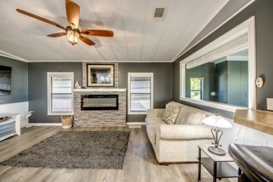 This unique two-bedroom, two-bath home in the gated, golf-course on Lake Fairways Country Club in Florida - for sale on GolfHomes.com, golf home, golf lot