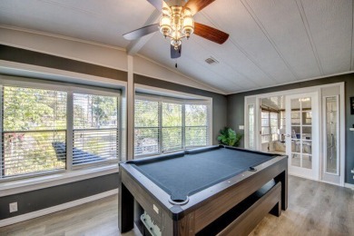 This unique two-bedroom, two-bath home in the gated, golf-course on Lake Fairways Country Club in Florida - for sale on GolfHomes.com, golf home, golf lot