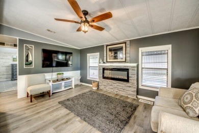 This unique two-bedroom, two-bath home in the gated, golf-course on Lake Fairways Country Club in Florida - for sale on GolfHomes.com, golf home, golf lot