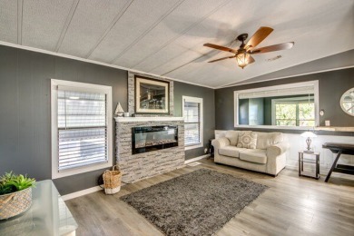 This unique two-bedroom, two-bath home in the gated, golf-course on Lake Fairways Country Club in Florida - for sale on GolfHomes.com, golf home, golf lot