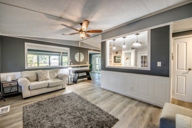 This unique two-bedroom, two-bath home in the gated, golf-course on Lake Fairways Country Club in Florida - for sale on GolfHomes.com, golf home, golf lot
