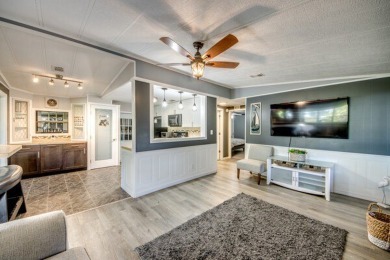 This unique two-bedroom, two-bath home in the gated, golf-course on Lake Fairways Country Club in Florida - for sale on GolfHomes.com, golf home, golf lot