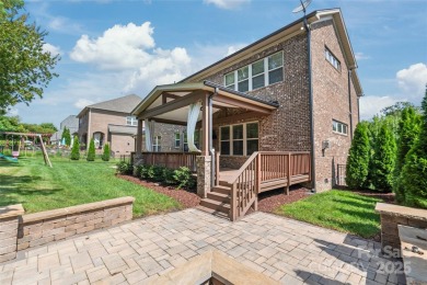 Discover timeless elegance in this full-brick stately Skybrook on Skybrook Golf Club in North Carolina - for sale on GolfHomes.com, golf home, golf lot