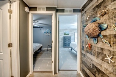 This unique two-bedroom, two-bath home in the gated, golf-course on Lake Fairways Country Club in Florida - for sale on GolfHomes.com, golf home, golf lot