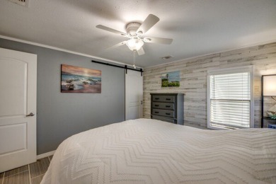 This unique two-bedroom, two-bath home in the gated, golf-course on Lake Fairways Country Club in Florida - for sale on GolfHomes.com, golf home, golf lot
