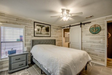 This unique two-bedroom, two-bath home in the gated, golf-course on Lake Fairways Country Club in Florida - for sale on GolfHomes.com, golf home, golf lot