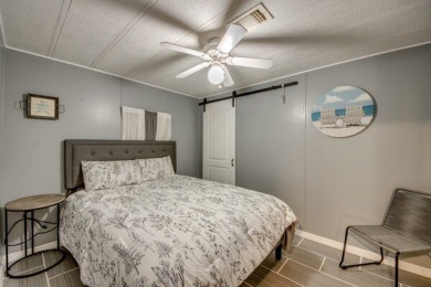 This unique two-bedroom, two-bath home in the gated, golf-course on Lake Fairways Country Club in Florida - for sale on GolfHomes.com, golf home, golf lot