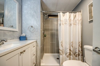This unique two-bedroom, two-bath home in the gated, golf-course on Lake Fairways Country Club in Florida - for sale on GolfHomes.com, golf home, golf lot