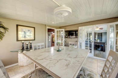 This unique two-bedroom, two-bath home in the gated, golf-course on Lake Fairways Country Club in Florida - for sale on GolfHomes.com, golf home, golf lot