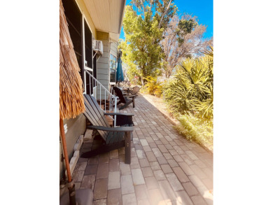 This unique two-bedroom, two-bath home in the gated, golf-course on Lake Fairways Country Club in Florida - for sale on GolfHomes.com, golf home, golf lot