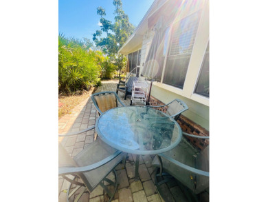 This unique two-bedroom, two-bath home in the gated, golf-course on Lake Fairways Country Club in Florida - for sale on GolfHomes.com, golf home, golf lot