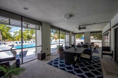 This unique two-bedroom, two-bath home in the gated, golf-course on Lake Fairways Country Club in Florida - for sale on GolfHomes.com, golf home, golf lot