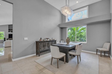 Experience luxury living on the 8th hole of the Match Course in on PGA National Golf Club in Florida - for sale on GolfHomes.com, golf home, golf lot