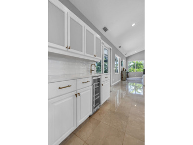 Experience luxury living on the 8th hole of the Match Course in on PGA National Golf Club in Florida - for sale on GolfHomes.com, golf home, golf lot