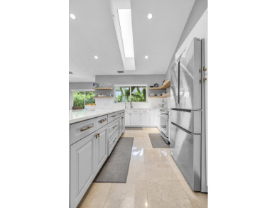 Experience luxury living on the 8th hole of the Match Course in on PGA National Golf Club in Florida - for sale on GolfHomes.com, golf home, golf lot