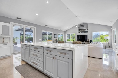 Experience luxury living on the 8th hole of the Match Course in on PGA National Golf Club in Florida - for sale on GolfHomes.com, golf home, golf lot