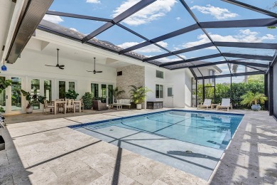 Experience luxury living on the 8th hole of the Match Course in on PGA National Golf Club in Florida - for sale on GolfHomes.com, golf home, golf lot
