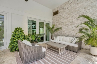 Experience luxury living on the 8th hole of the Match Course in on PGA National Golf Club in Florida - for sale on GolfHomes.com, golf home, golf lot