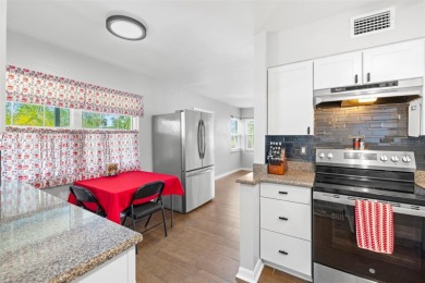 Welcome to this beautifully updated single-family pool home in on The Dunedin Country Club in Florida - for sale on GolfHomes.com, golf home, golf lot