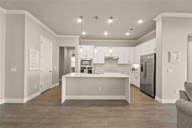 Welcome to a home that blends designer style with everyday on Wildhorse Golf Club of Robson Ranch in Texas - for sale on GolfHomes.com, golf home, golf lot
