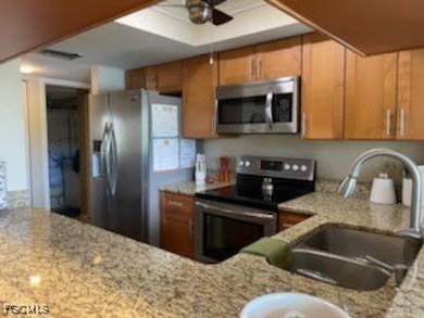 Quick move-in! Home is 2/2, lake view, steps from pool, first on Hideaway Country Club in Florida - for sale on GolfHomes.com, golf home, golf lot