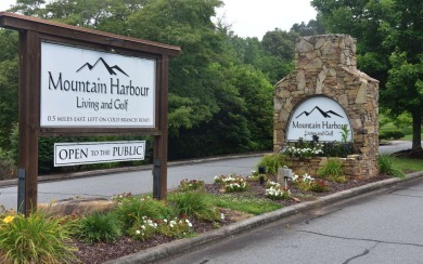 Overlooking the 7th green and fairway from this elevated long on Mountain Harbour Golf Club in North Carolina - for sale on GolfHomes.com, golf home, golf lot
