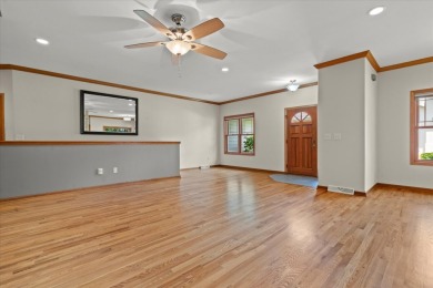Enjoy gorgeous views in this impressive condo on the 13th hole on Meadowbrook Country Club in Wisconsin - for sale on GolfHomes.com, golf home, golf lot