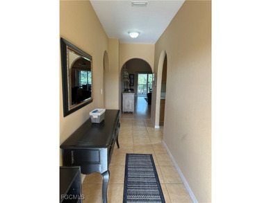 This 2nd-floor end-unit condo is shaded by mature trees and on Westminster Golf Club in Florida - for sale on GolfHomes.com, golf home, golf lot