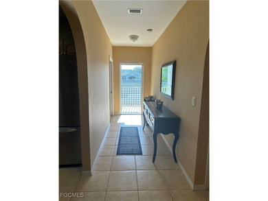This 2nd-floor end-unit condo is shaded by mature trees and on Westminster Golf Club in Florida - for sale on GolfHomes.com, golf home, golf lot