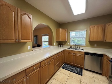 This 2nd-floor end-unit condo is shaded by mature trees and on Westminster Golf Club in Florida - for sale on GolfHomes.com, golf home, golf lot