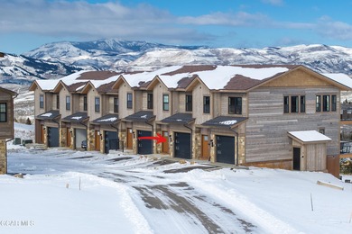 This luxurious townhome can be seen rising above the Granby on Headwaters Golf Course At Granby Ranch in Colorado - for sale on GolfHomes.com, golf home, golf lot