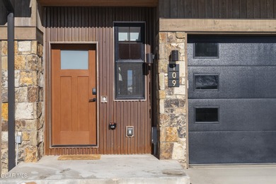 This luxurious townhome can be seen rising above the Granby on Headwaters Golf Course At Granby Ranch in Colorado - for sale on GolfHomes.com, golf home, golf lot