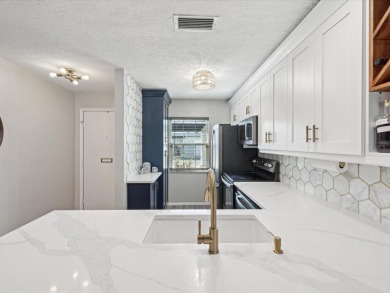Completely updated, luxurious unit located within the gates of on Seven Springs Golf and Country Club in Florida - for sale on GolfHomes.com, golf home, golf lot