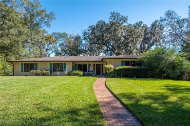 Nestled within the Gainesville Country Club, this extensively on Gainesville Golf and Country Club in Florida - for sale on GolfHomes.com, golf home, golf lot