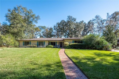 Nestled within the Gainesville Country Club, this extensively on Gainesville Golf and Country Club in Florida - for sale on GolfHomes.com, golf home, golf lot