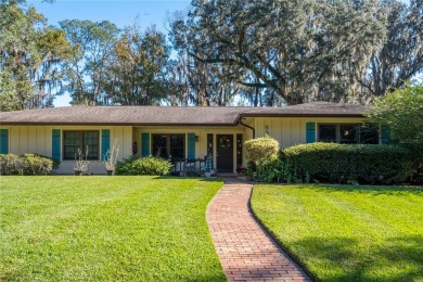 Nestled within the Gainesville Country Club, this extensively on Gainesville Golf and Country Club in Florida - for sale on GolfHomes.com, golf home, golf lot