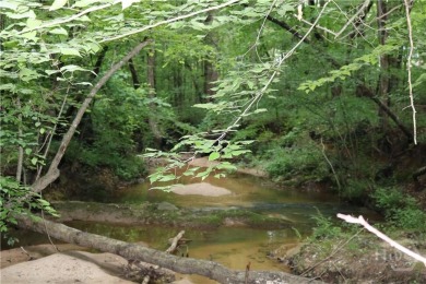 Established subdivision 1.18 acre lot, lot slopes from the road on Sunrise Golf Club in Georgia - for sale on GolfHomes.com, golf home, golf lot