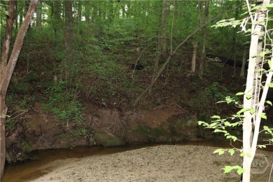 Established subdivision 1.18 acre lot, lot slopes from the road on Sunrise Golf Club in Georgia - for sale on GolfHomes.com, golf home, golf lot