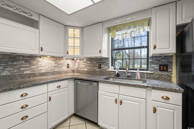 This well-maintained 2-bedroom, 2-bath home offers a bright on Heron Point Golf Club in South Carolina - for sale on GolfHomes.com, golf home, golf lot