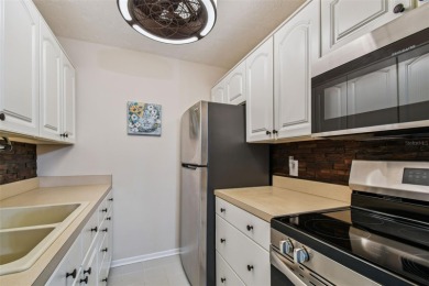 Welcome to this bright corner unit located on the second floor on Largo Golf Course in Florida - for sale on GolfHomes.com, golf home, golf lot
