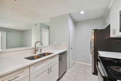 Spacious END UNIT with 3 bedrooms and 2 full bathrooms WITH A on Hunters Green Country Club in Florida - for sale on GolfHomes.com, golf home, golf lot