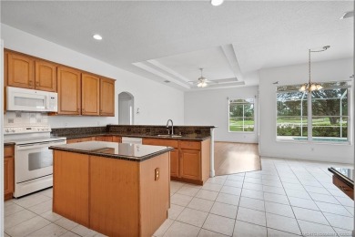 Step inside and fall in love with the view - a sparkling pool on Eagle Marsh Golf Club in Florida - for sale on GolfHomes.com, golf home, golf lot