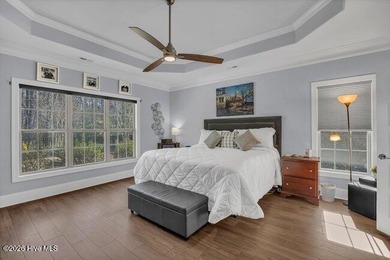 Experience luxury in this exquisite 3-bedroom, 3-bath all-brick on Cape Fear National At Brunswick Forest in North Carolina - for sale on GolfHomes.com, golf home, golf lot